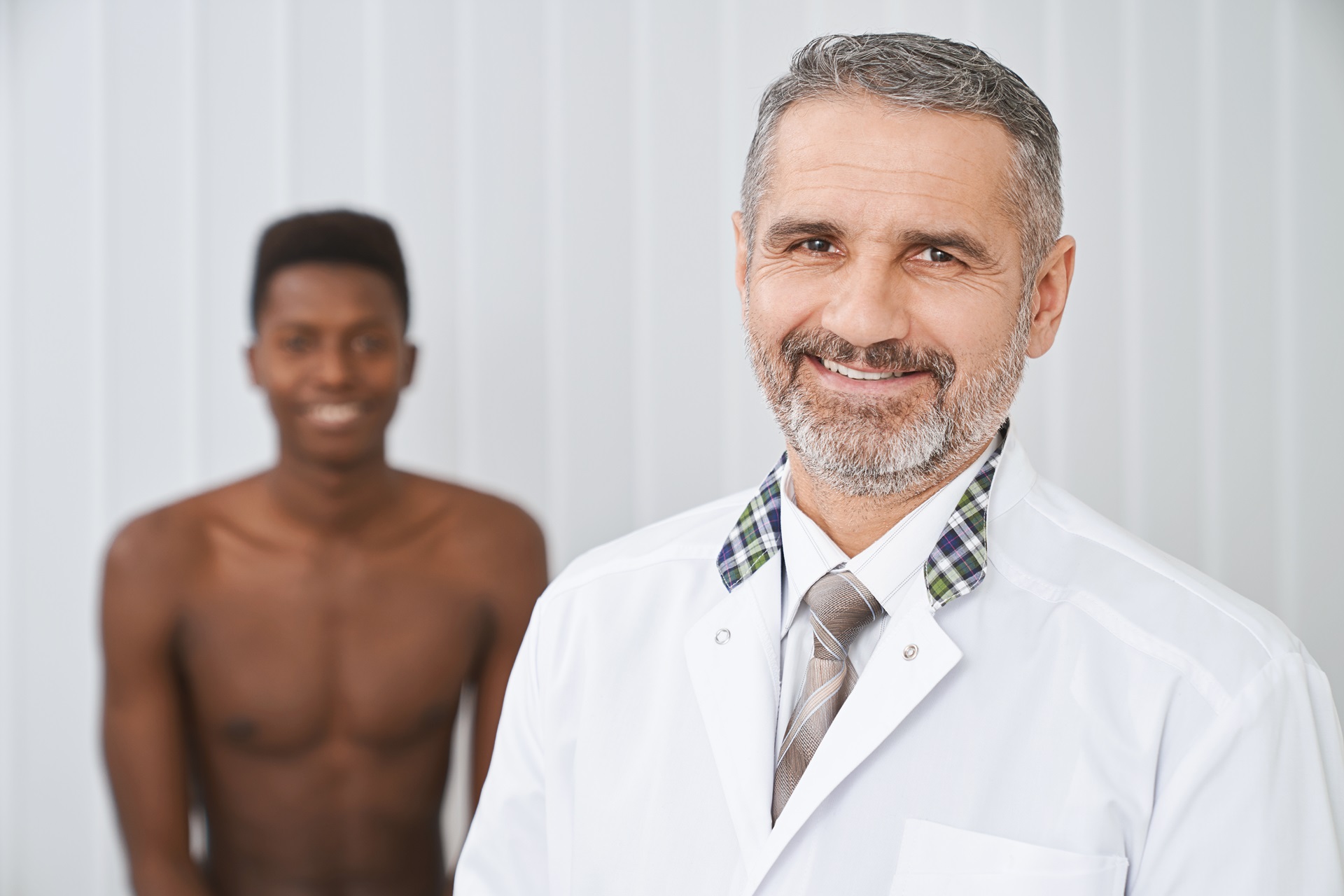 cheerful doctor and patient posing smiling 2023 11 27 05 05 39 utc
