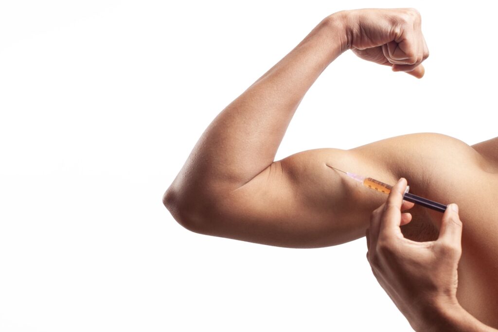 closeup of fit man injecting steroid supplement in 2023 11 27 05 20 04 utc