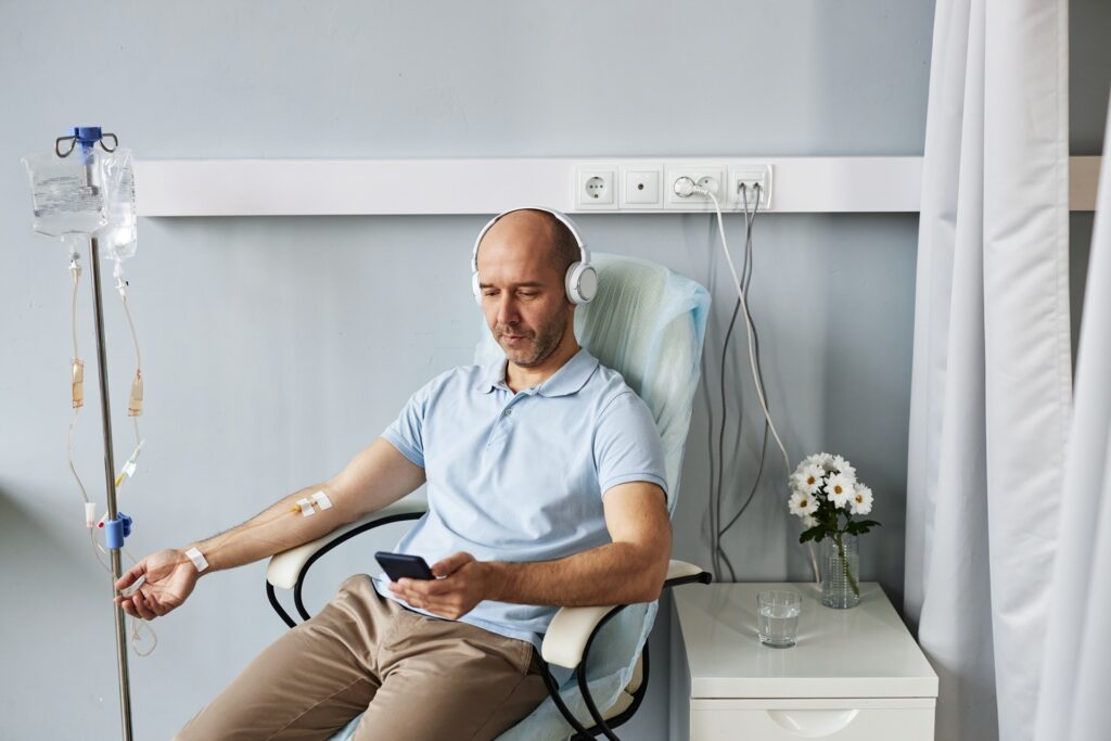 minimal adult man with headphones during iv drip t 2023 11 27 05 24 07 utc
