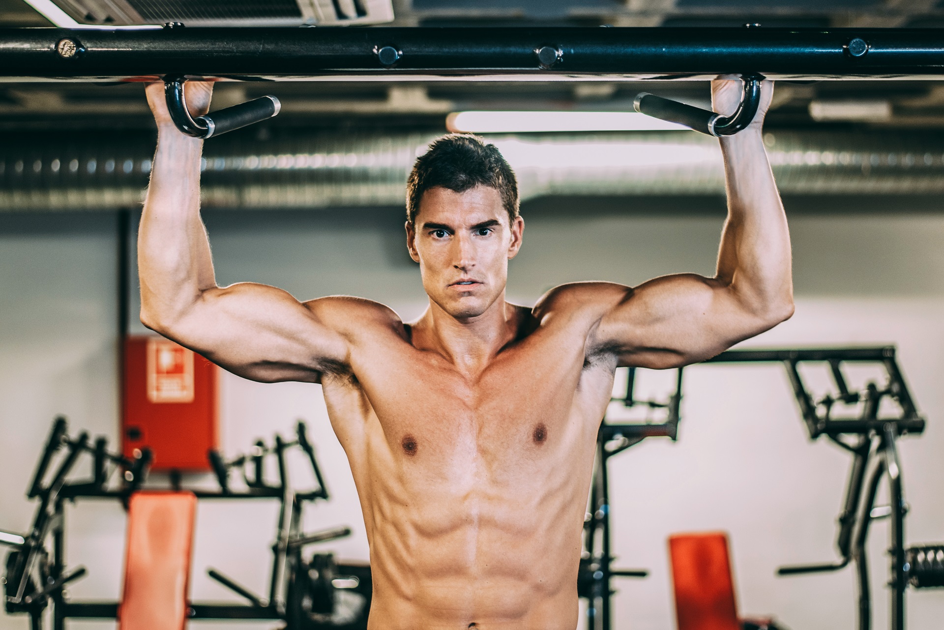 muscular man doing chin ups 2023 11 27 05 16 44 utc