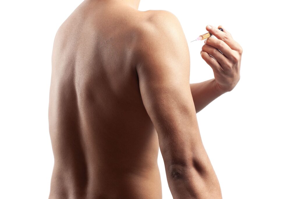 shirtless muscular man injecting testosterone syri 2023 11 27 05 27 39 utc